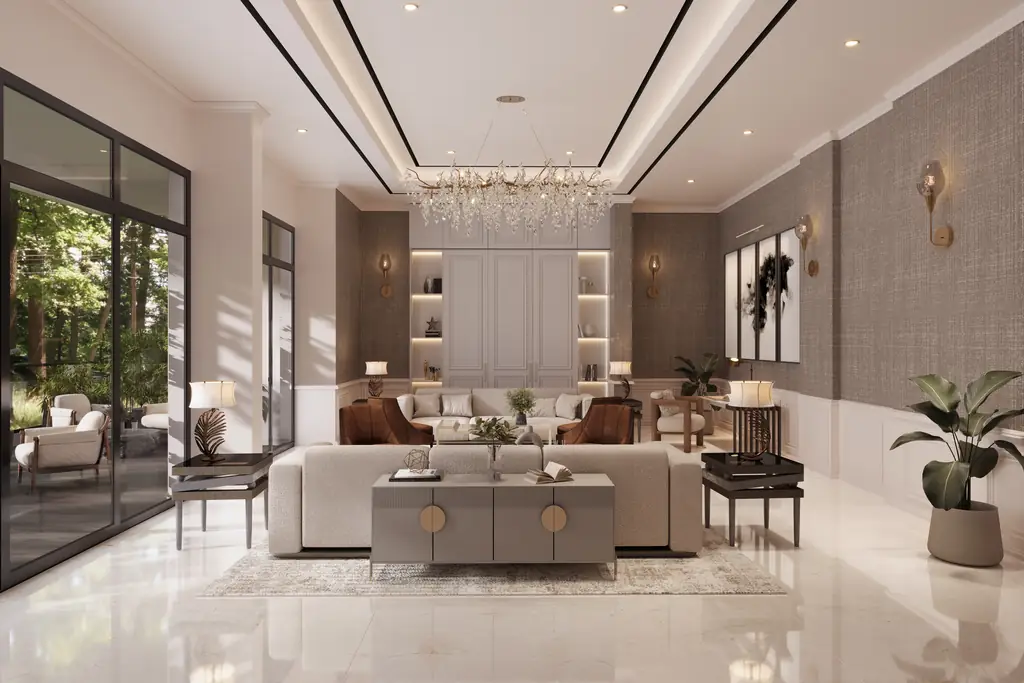A quiet lounge with sofas, a low table and a lit wall of shelves