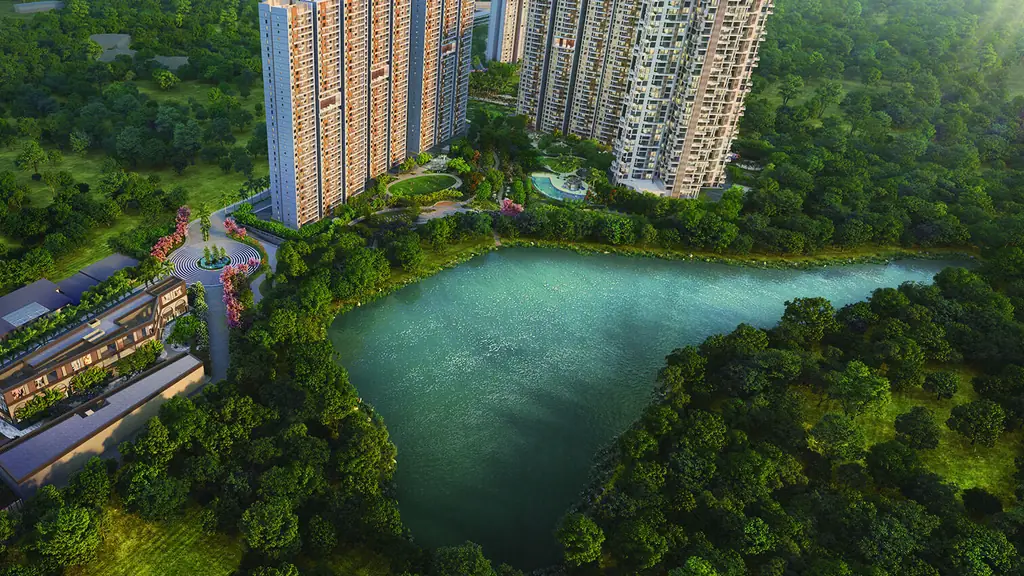 Aerial view at sunrise of the Lake Province towers and The Solitaire beside the lake, the high street and entrance in front