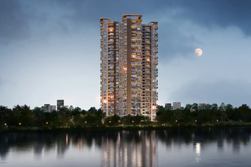 The lit tower of The Solitaire reflected in the still lake at night