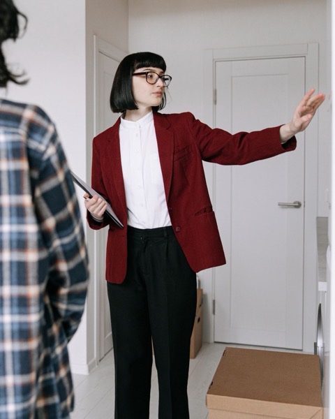 A sales manager showing a couple through an empty flat